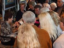 Signing CDs, photos, and Hatch Show Print posters for the great fans in Norway